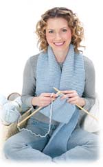 woman in jeans knitting